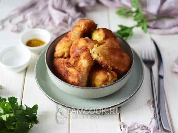 Фото готового блюда: Куриные крылышки в панировке на сковороде