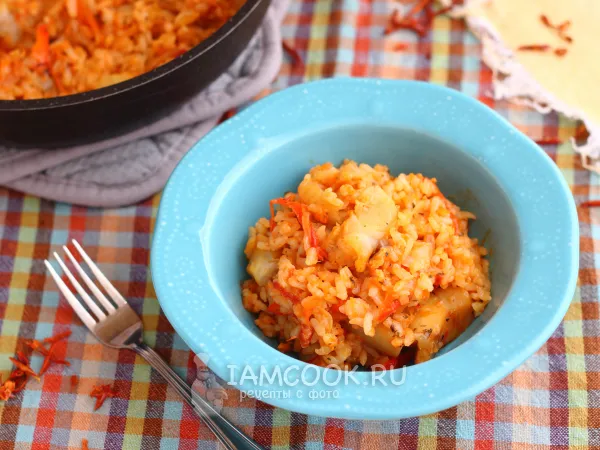 Фото готового блюда: Минтай с рисом на сковороде