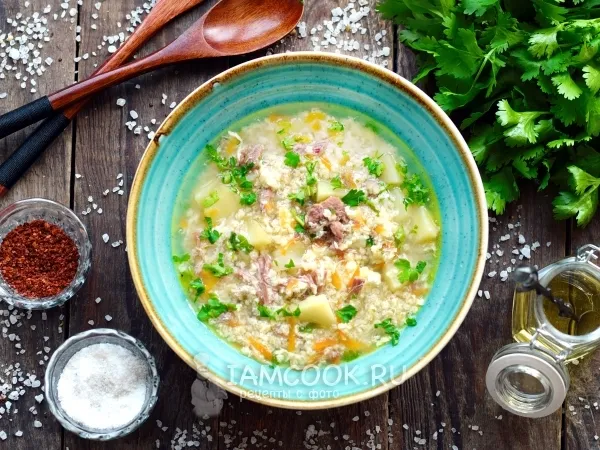 Фото готового блюда: Суп с тушенкой, пшеном и яйцом