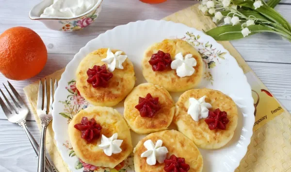 Фото блюда: Сырники с мандаринами