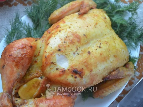 Фото готового блюда: Курица, фаршированная яблоками, в духовке