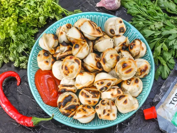 Фото готового блюда: Пельмени на мангале на решетке