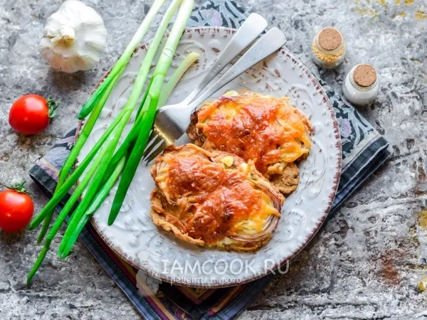 Фото готового блюда: Отбивные из свинины с чесноком в духовке