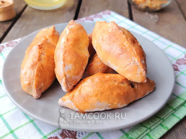 Фото готового блюда: Пирожки на кефире с квашеной капустой